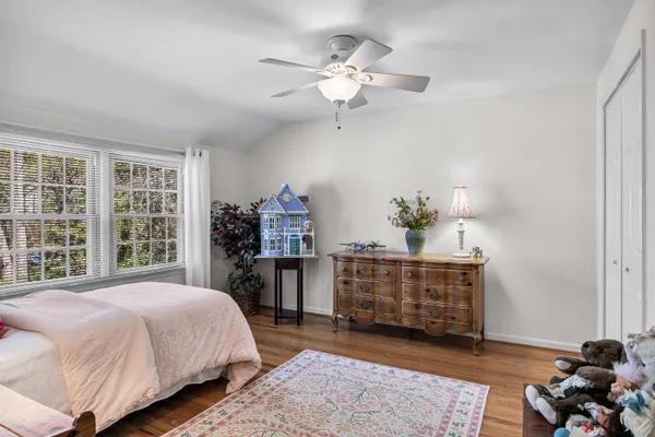 a view of a house with a yard and potted plants