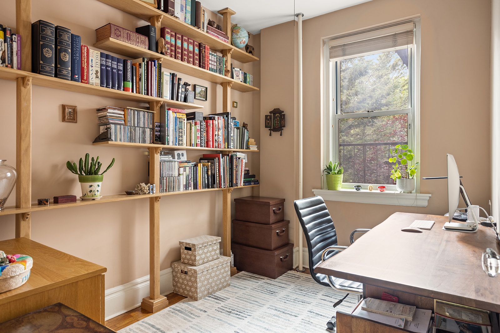 35-56 79th Street, Unit 22 Queens, NY 11372 - Photo 9 of 14 a view of a workspace with furniture and a window