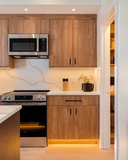 a kitchen with a stove and a microwave