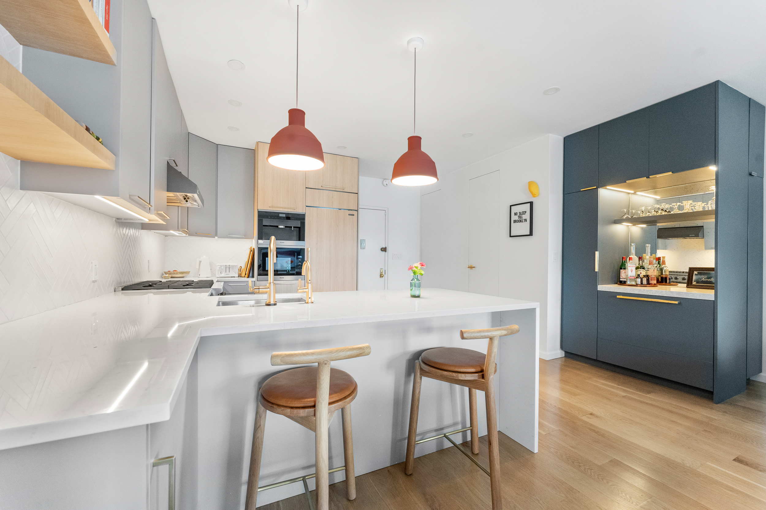 55 Poplar Street, Unit 6A Brooklyn, NY 11201 - Photo 4 of 13 a kitchen with kitchen island a stove a table and chairs in it
