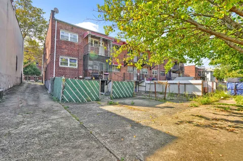a view of backyard with green space