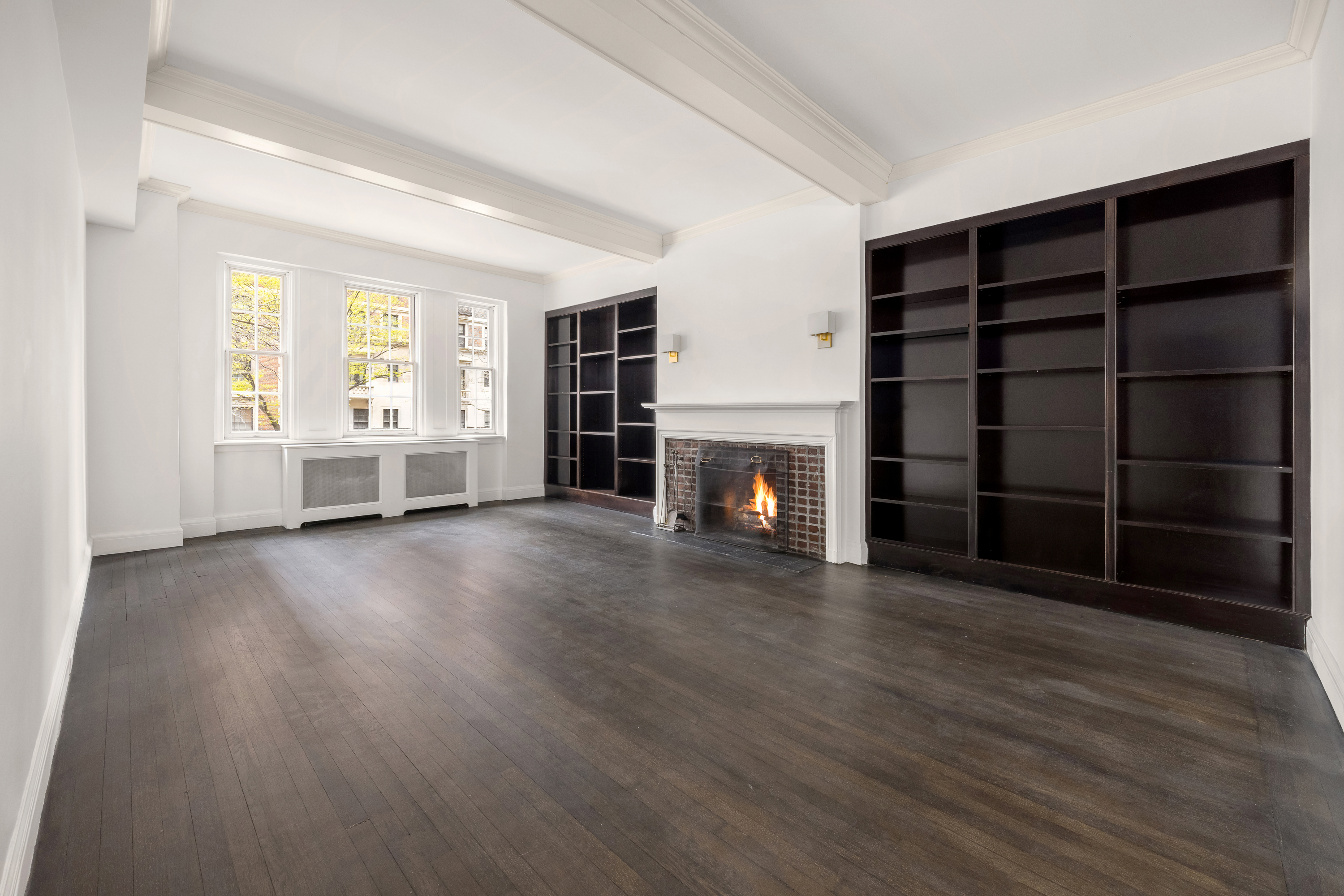 39 5th Avenue, Unit 2B Manhattan, NY 10003 - Photo 2 of 10 wooden floor in an empty room with a fireplace