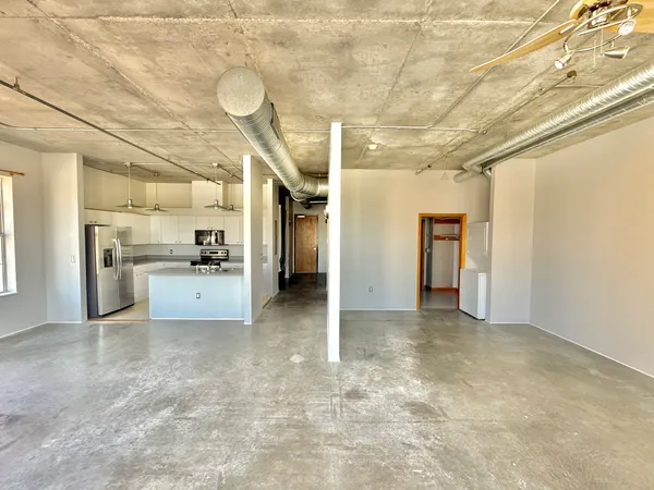 a view of an empty room with a window