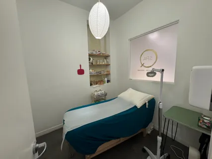 a bedroom with a bed a desk and chair