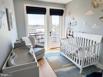 a room with furniture and a large window