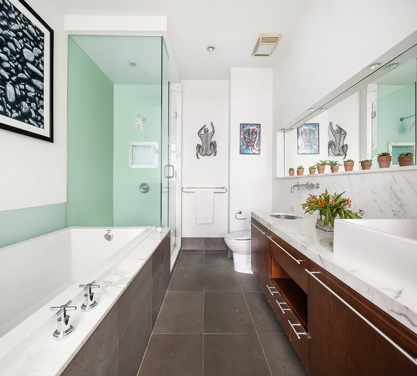 60 Broadway, Unit 6A Brooklyn, NY 11249 - Photo 10 of 14 a spacious bathroom with a granite countertop tub sink and mirror