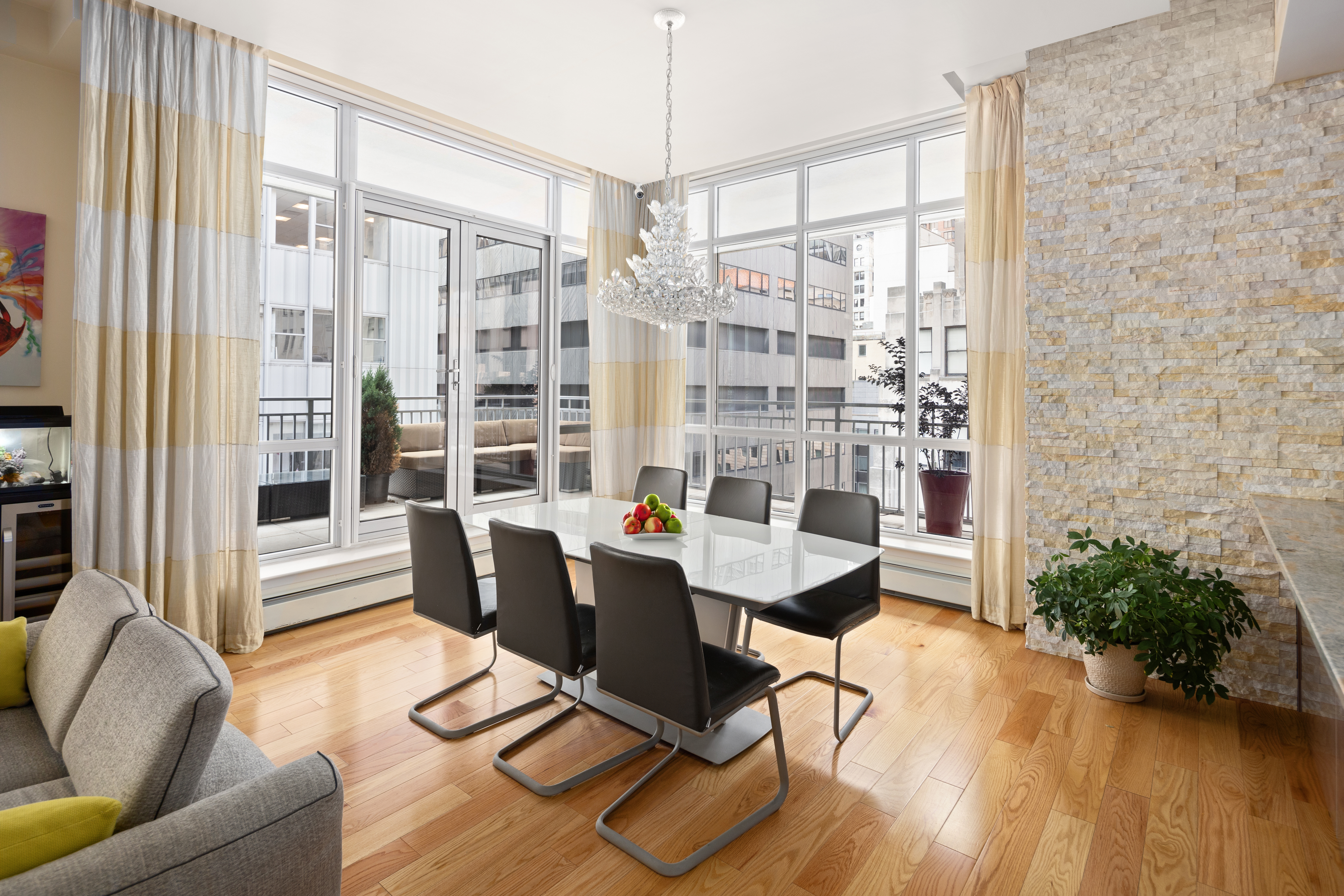 59 John Street, Unit PH1 Manhattan, NY 10038 - Photo 3 of 15 a workspace with furniture and a large window