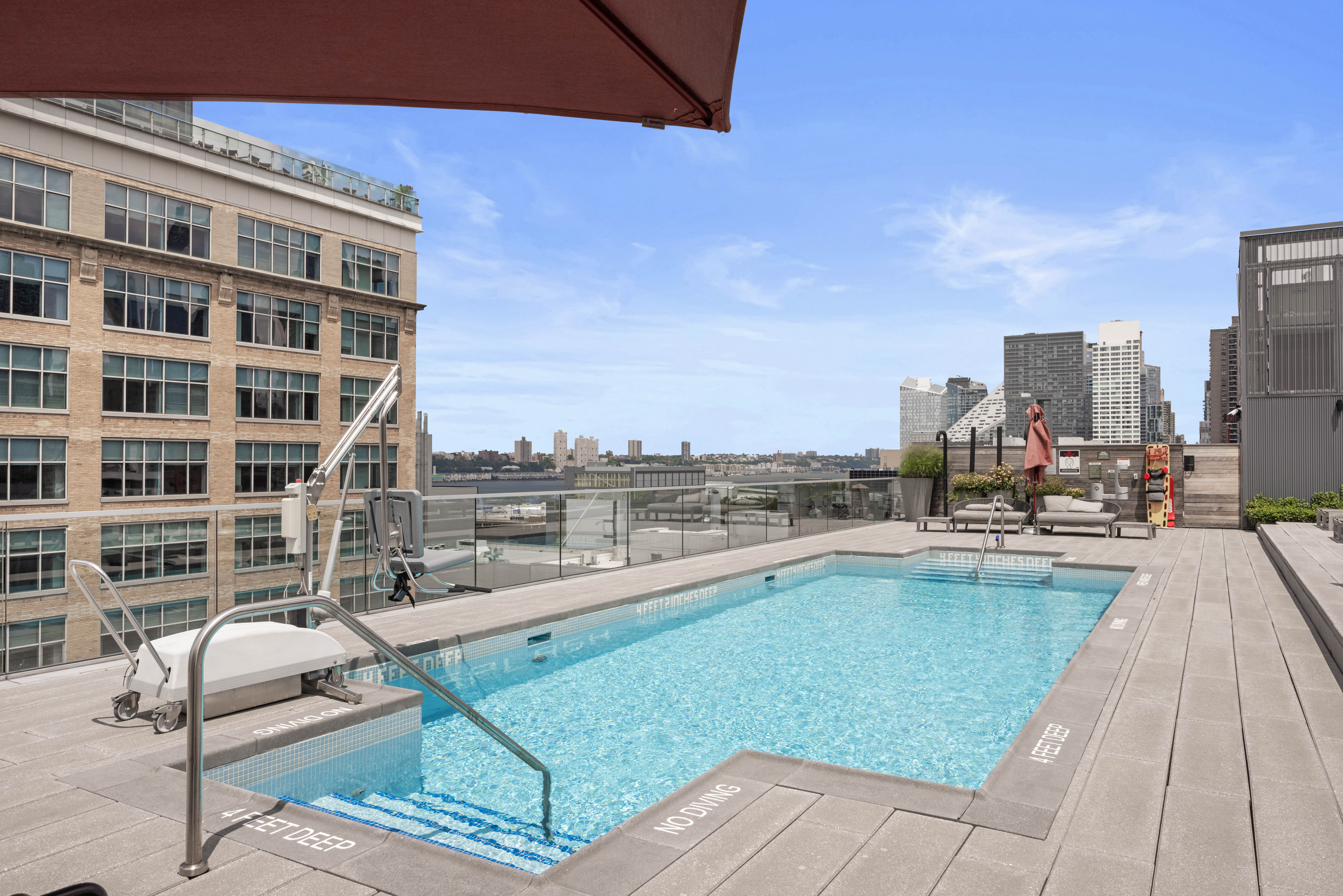547 West 47th Street, Unit 509 Manhattan, NY 10036 - Photo 16 of 29 a view of a swimming pool with outdoor seating