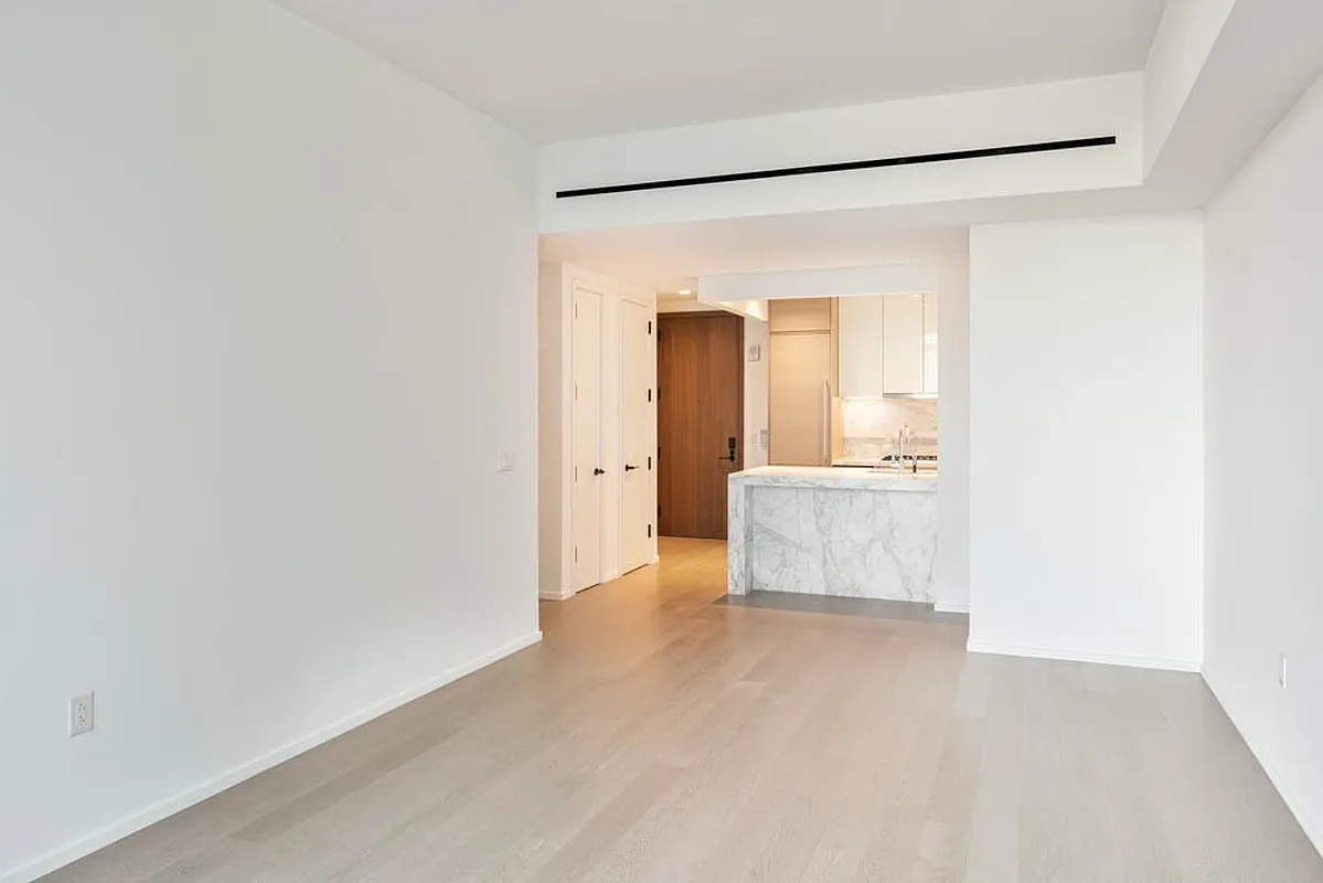 30 Riverside Boulevard, Unit 23L Manhattan, NY 10069 - Photo 2 of 23 a room with a refrigerator and a sink