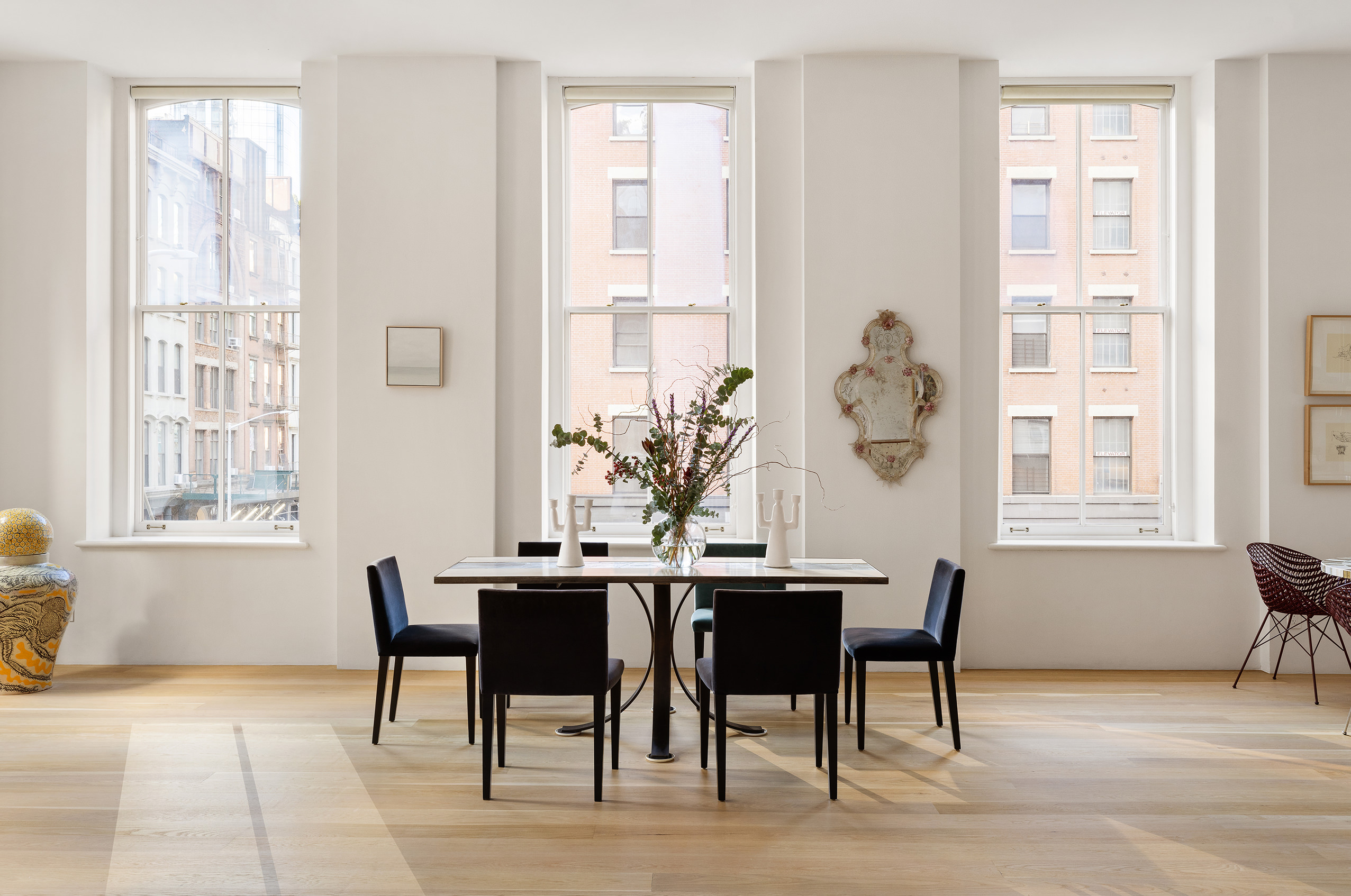 60 Warren Street, Unit 2 Manhattan, NY 10007 - Photo 3 of 16 a view of a dining room with furniture and windows