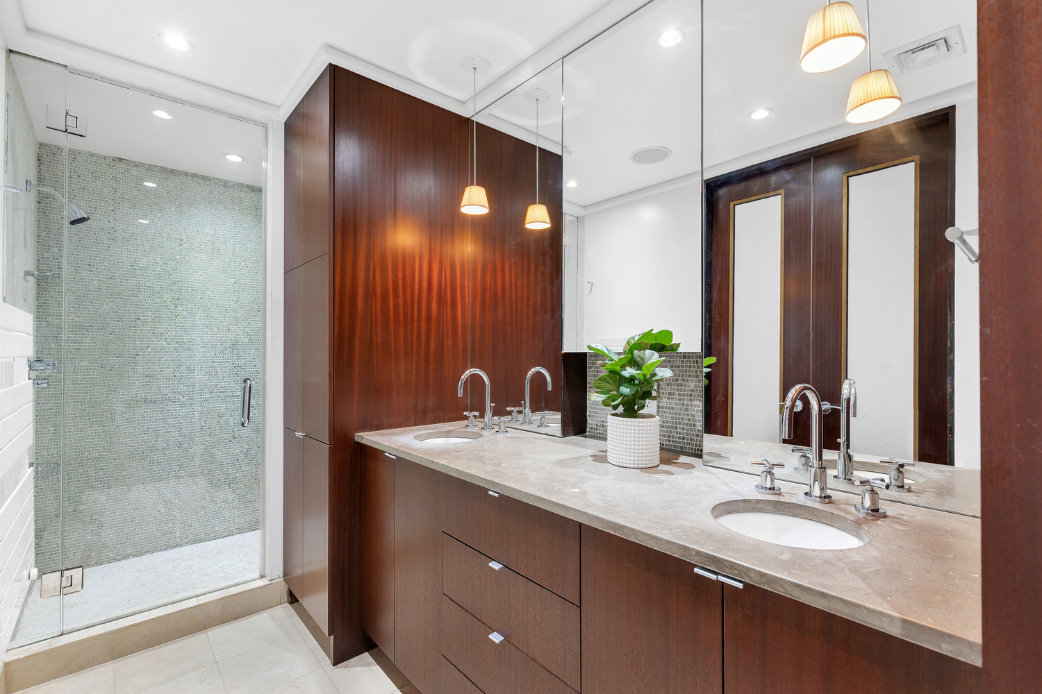 200 Mercer Street, Unit MAIS-G Manhattan, NY 10012 - Photo 10 of 17 a bathroom with double vanity sinks and a mirror