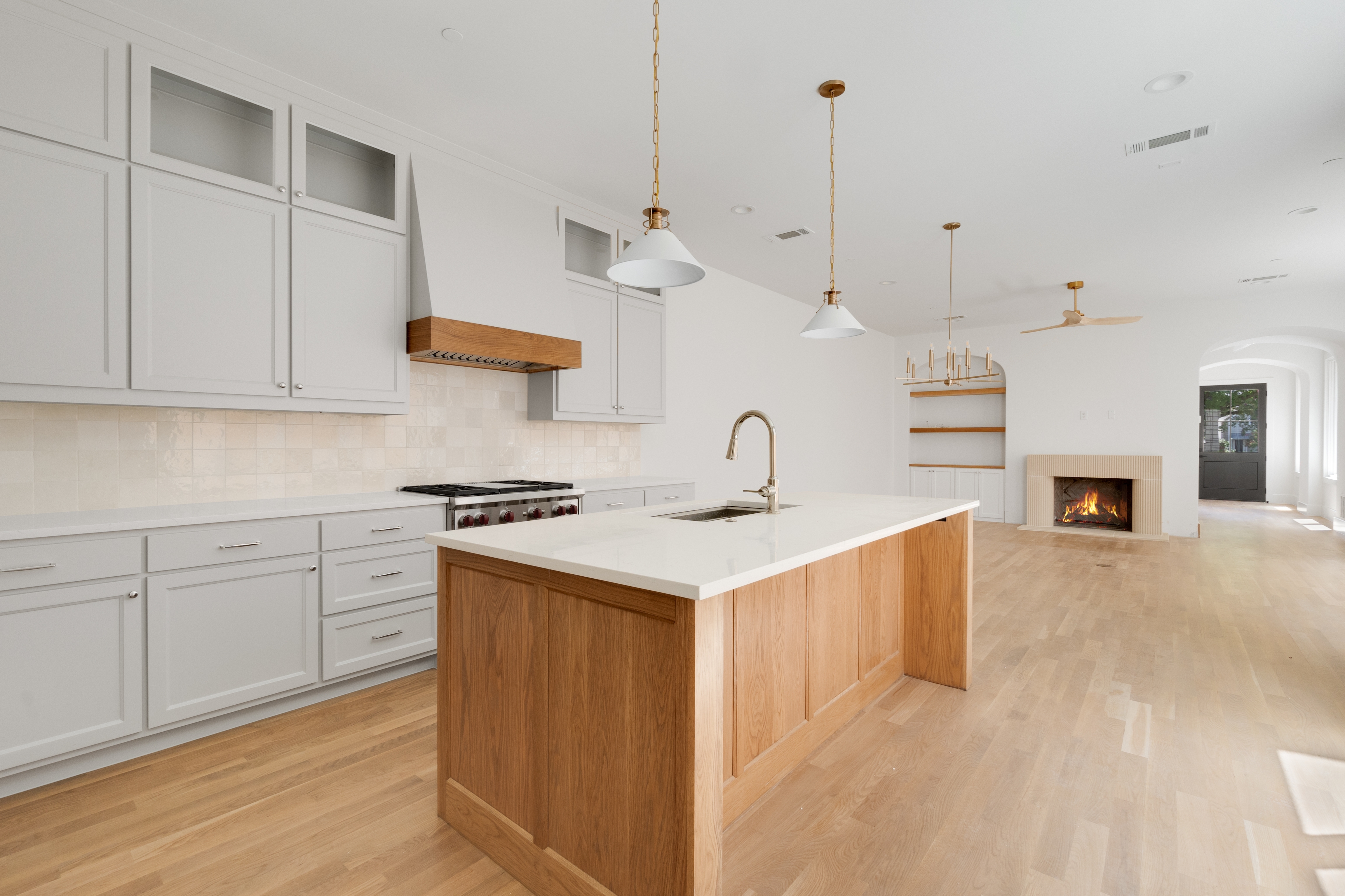 4410 Glenwick Lane Dallas, TX 75205 - Photo 10 of 28 a kitchen with stainless steel appliances granite countertop a sink a stove and a wooden floors
