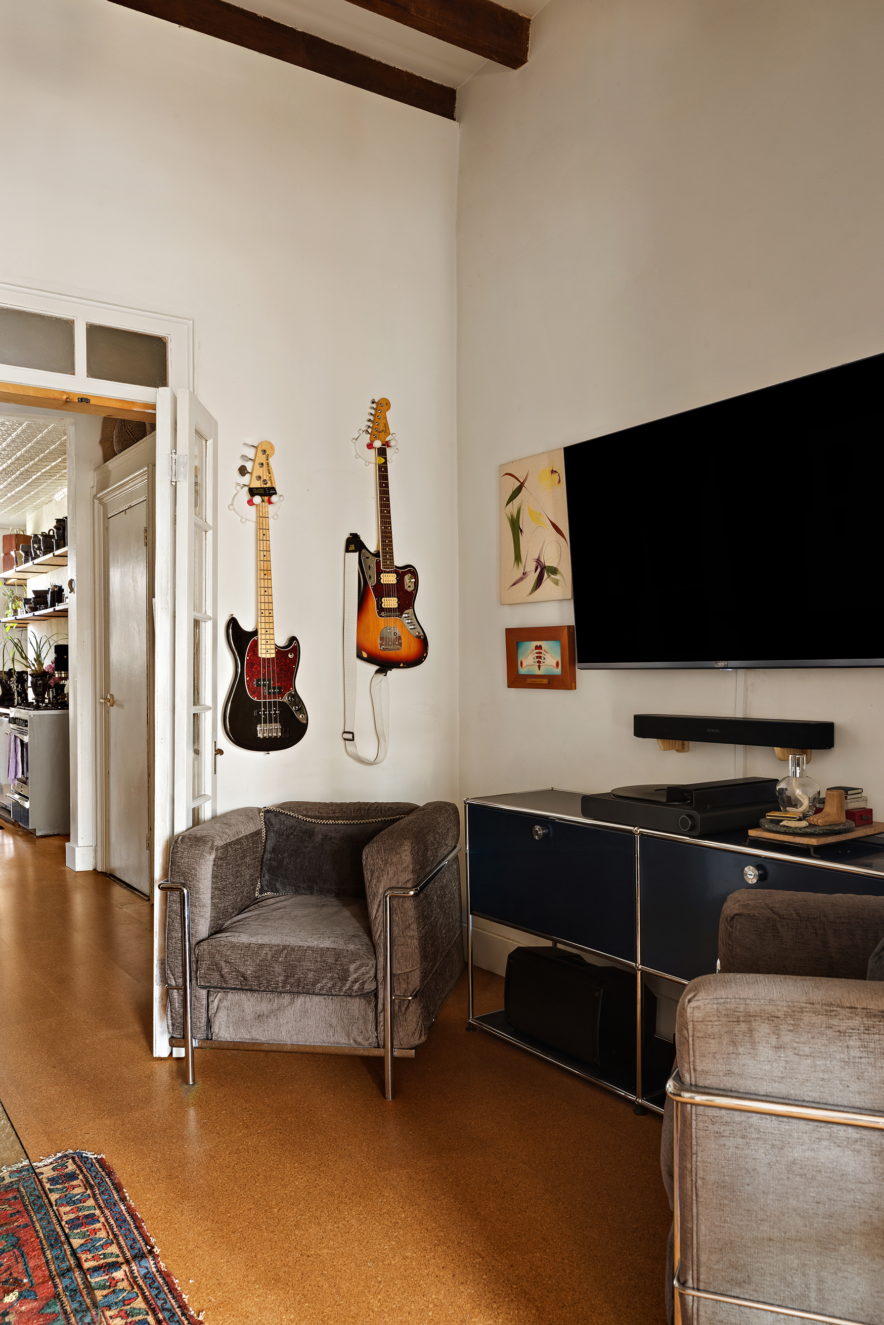 151 Grand Street, Unit 8 Brooklyn, NY 11249 - Photo 10 of 20 a view of a livingroom with furniture and flat screen tv