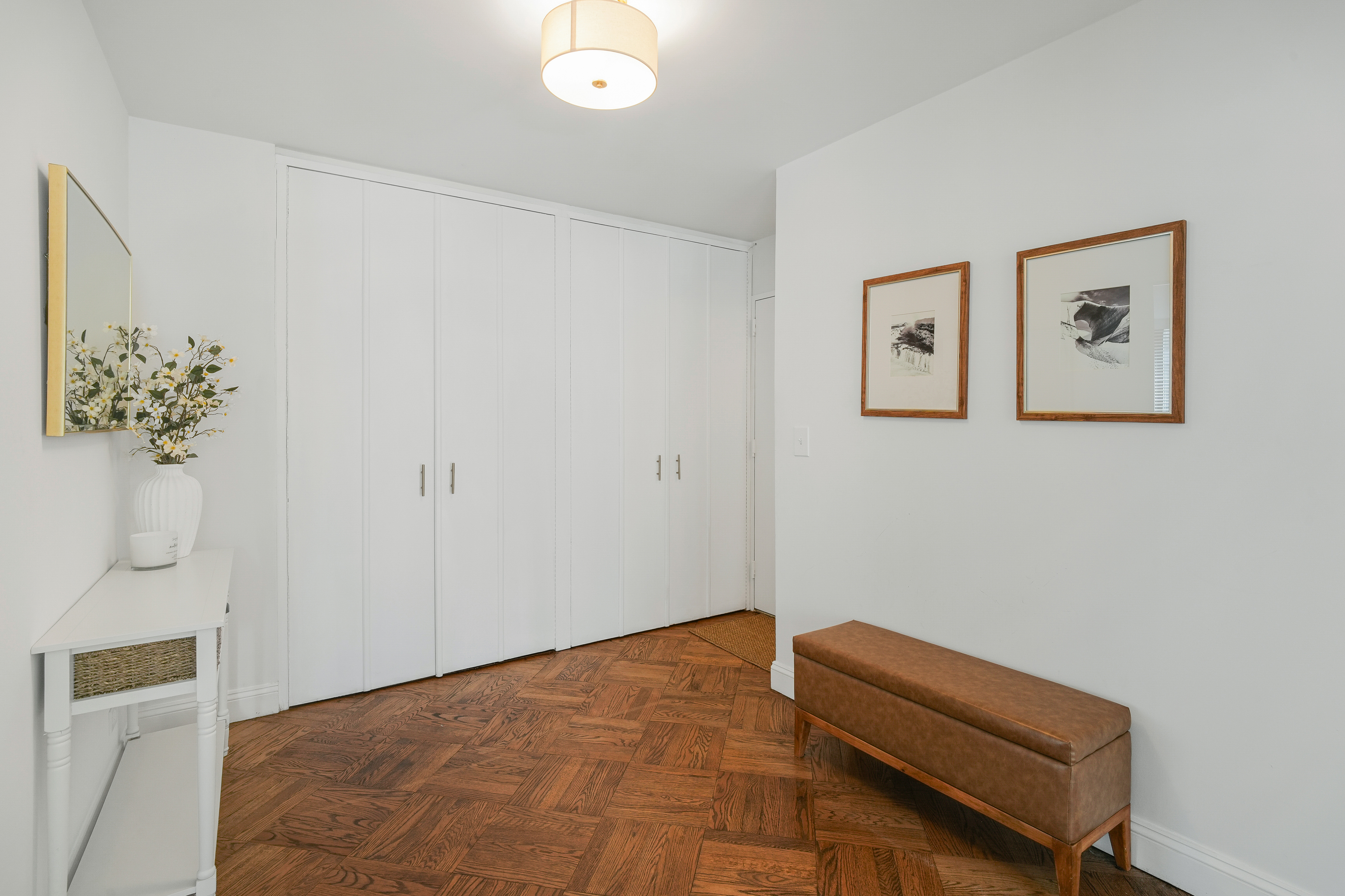 171 East 84th Street, Unit 4B Manhattan, NY 10028 - Photo 12 of 20 a bedroom with a bed and a couch