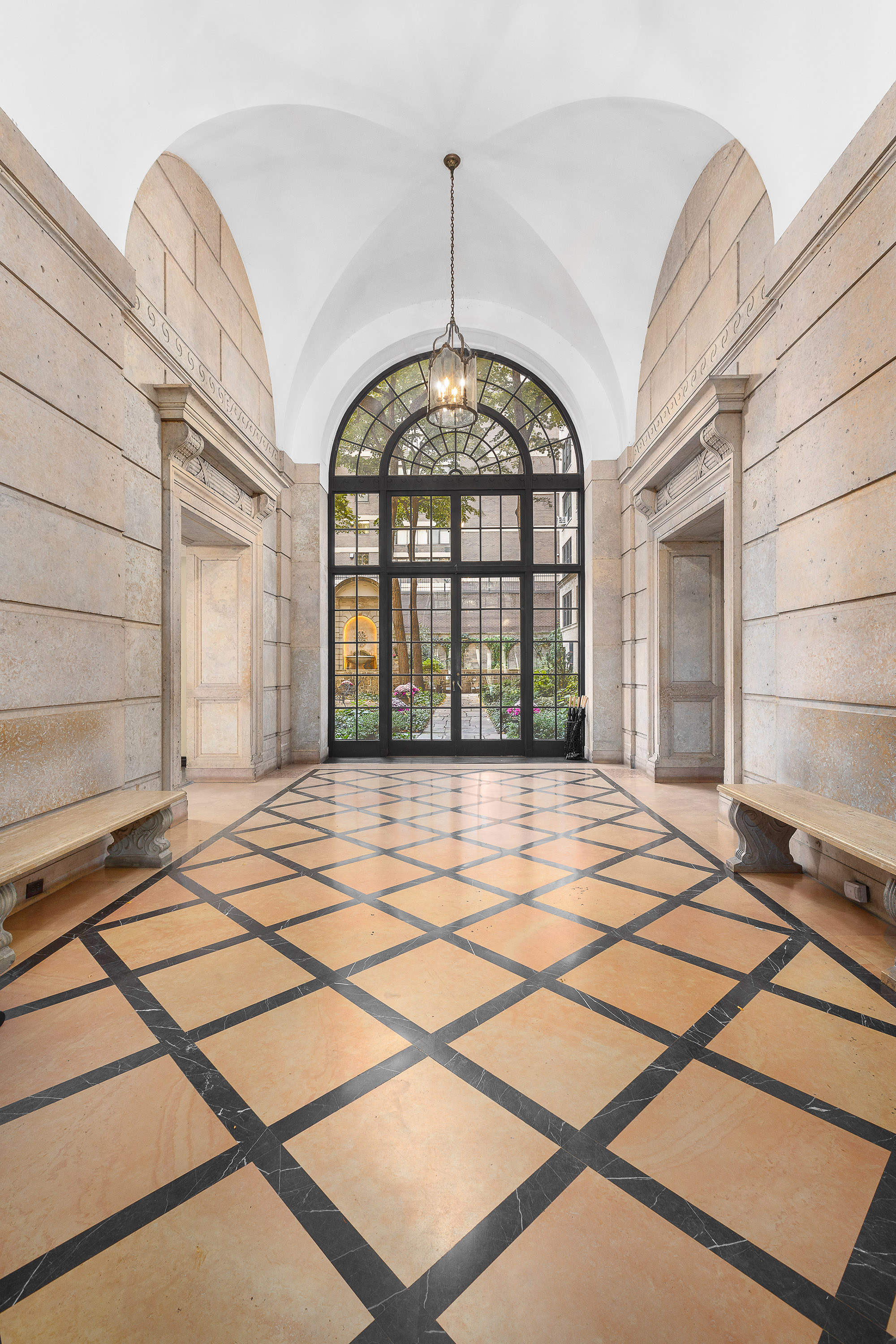 1088 Park Avenue, Unit 15C Manhattan, NY 10128 - Photo 19 of 26 a view of an entryway with a chandelier