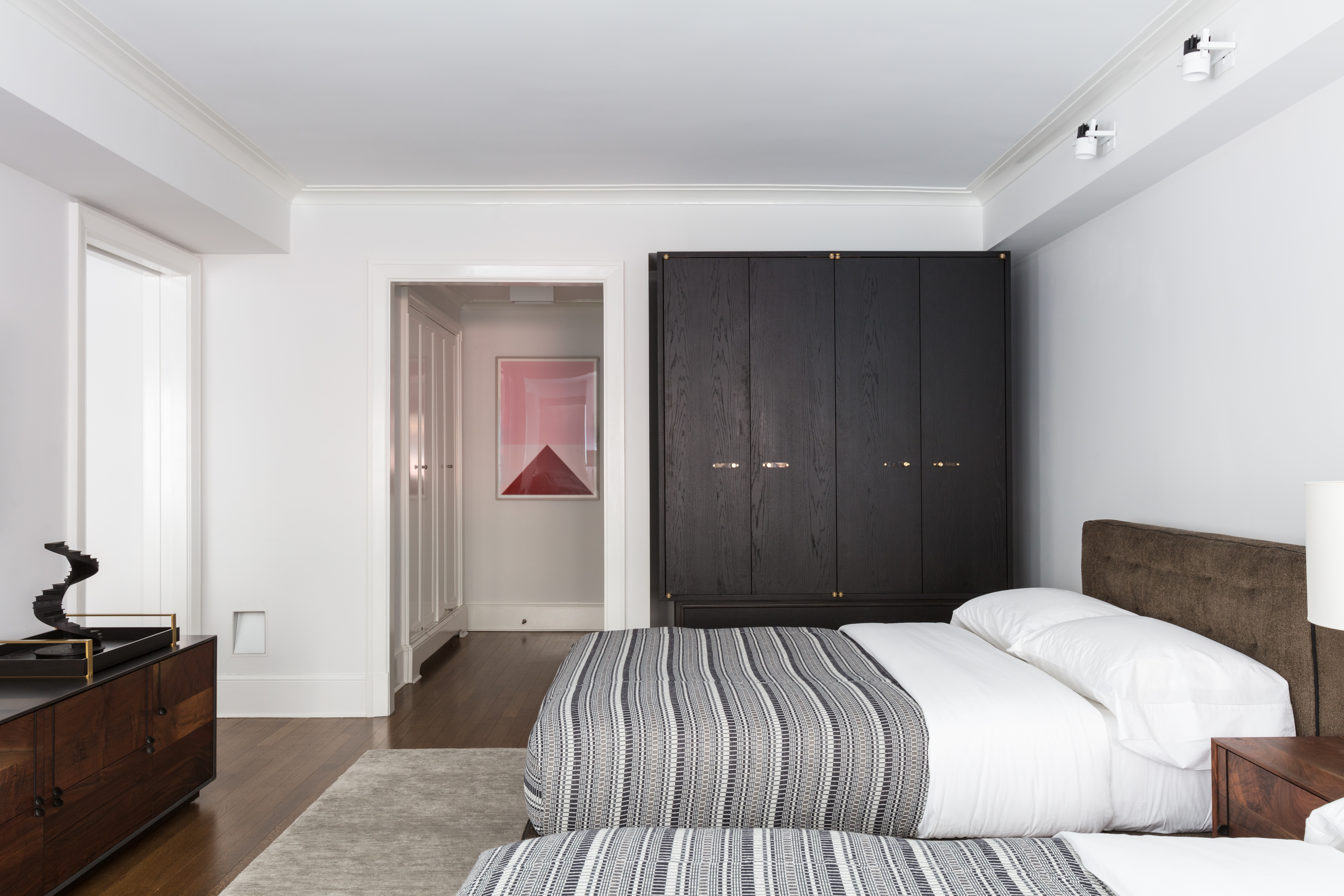 530 Park Avenue, Unit 2F Manhattan, NY 10065 - Photo 11 of 19 a bedroom with a bed and wooden floor