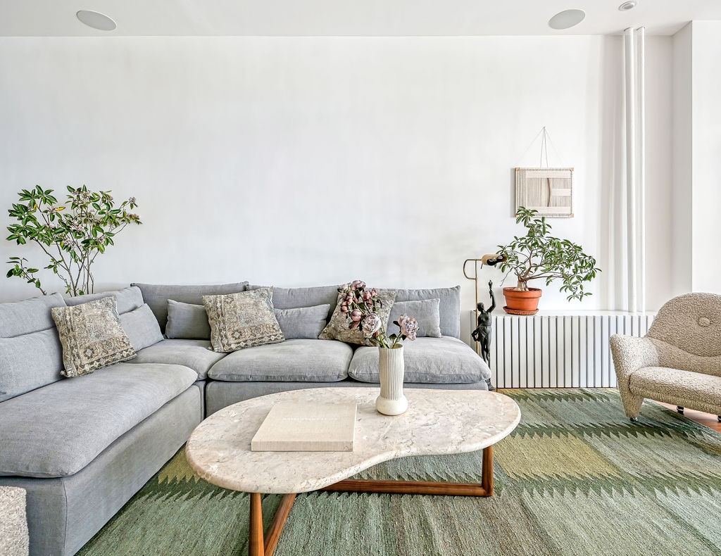 42 East 12th Street, Unit 2 Manhattan, NY 10003 - Photo 2 of 18 a living room with furniture and a rug