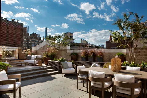 a outdoor living space with patio furniture and a potted plants