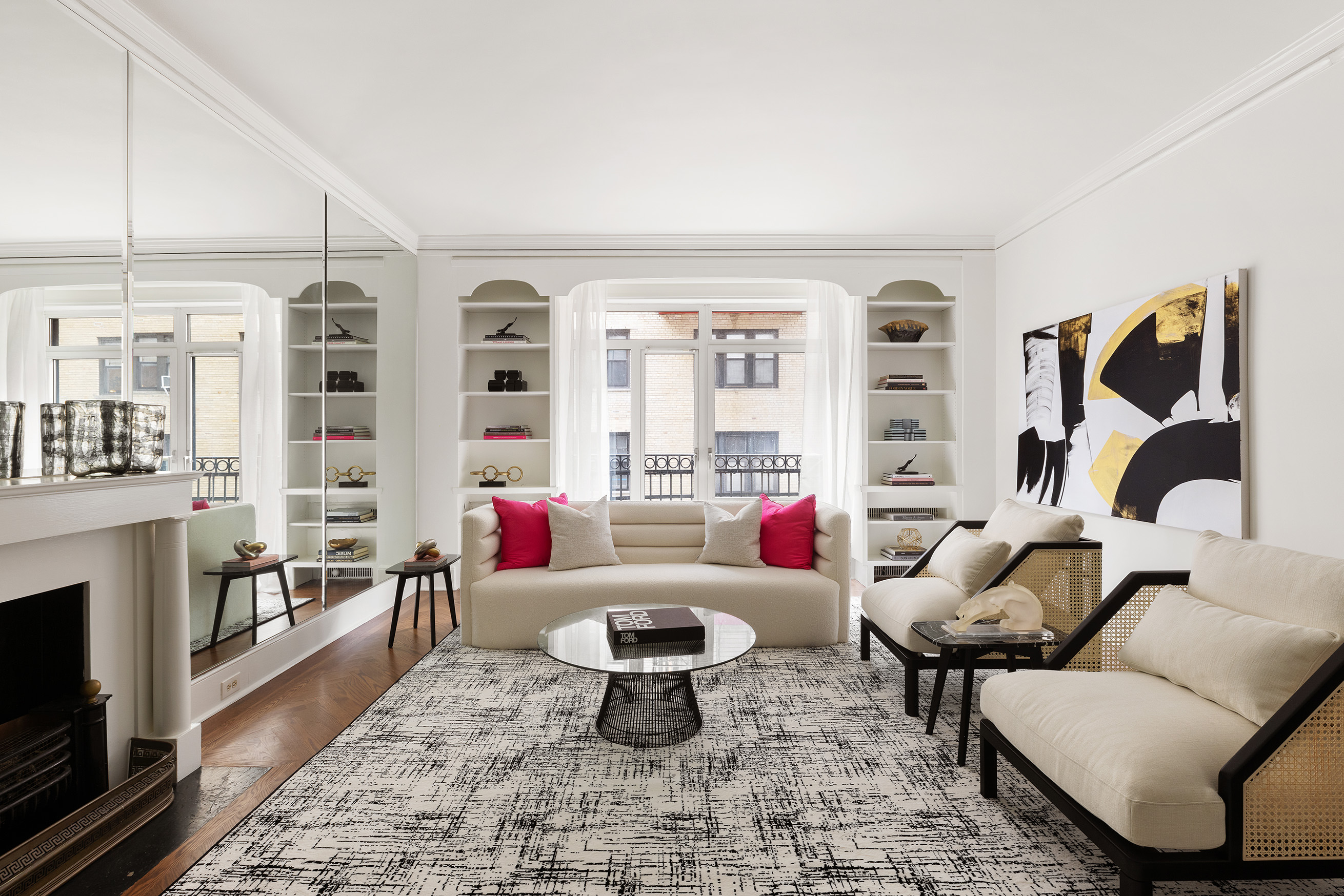 a living room with furniture and a fireplace