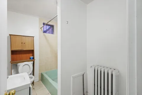 a bathroom with a granite countertop shower