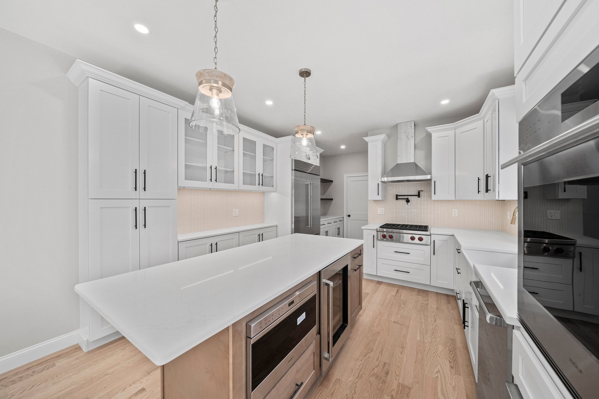 3 Everendon Road Canton, MA 02021 - Photo 5 of 35 a large kitchen with kitchen island a stove a sink a center island and wooden floor