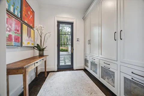 a bedroom with furniture and large windows