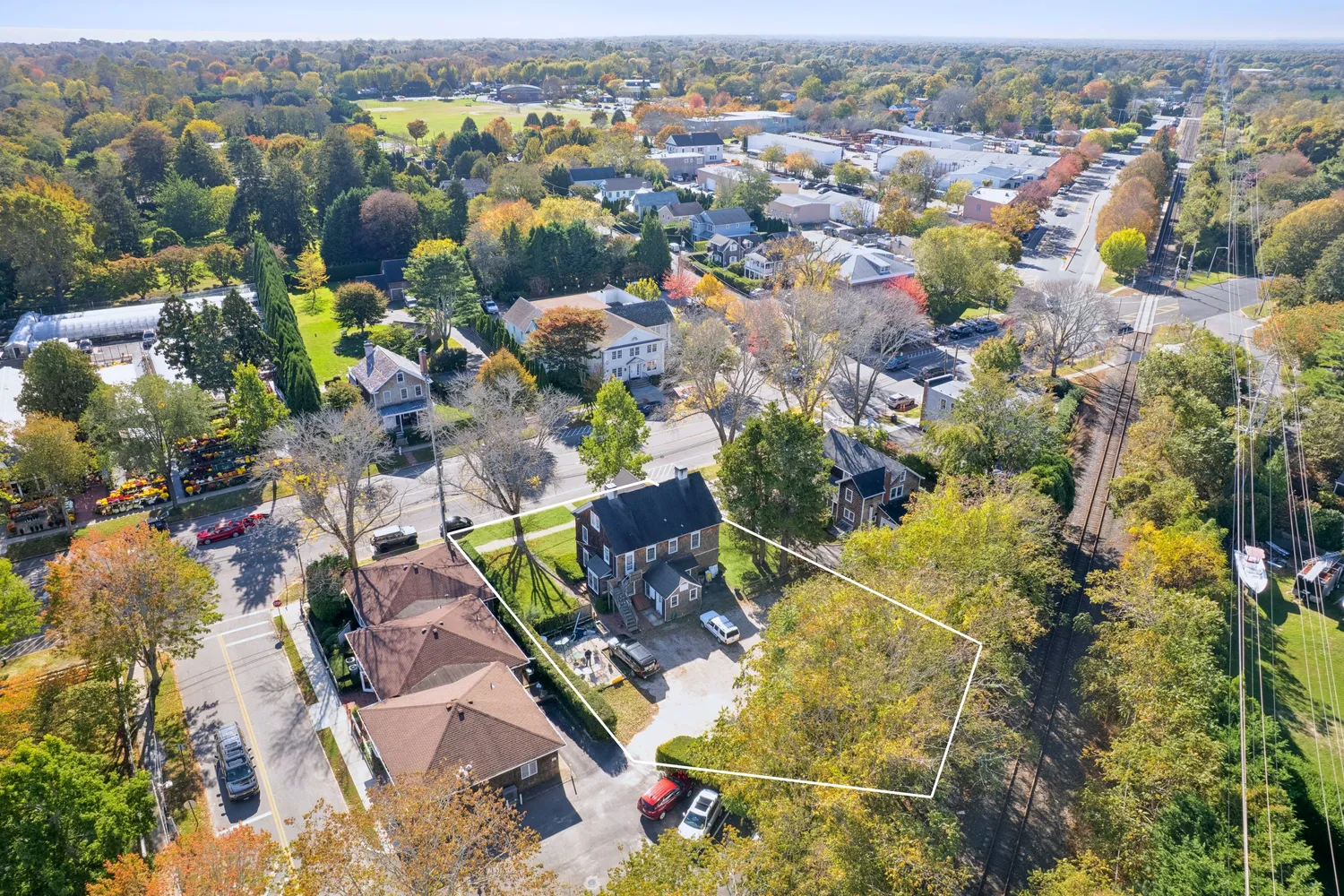 an aerial view of residential houses with outdoor space
