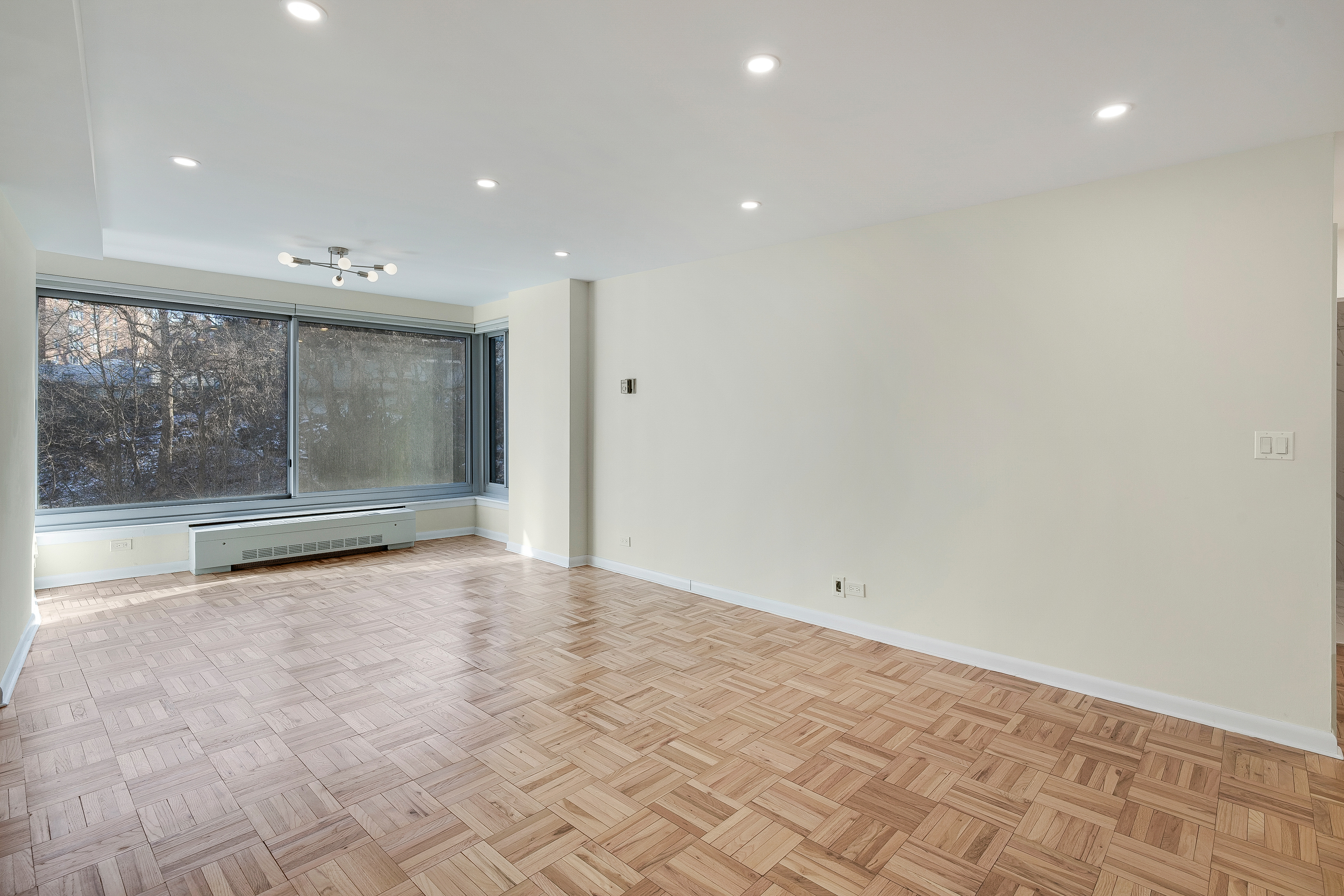4455 Douglas Avenue, Unit 8A Bronx, NY 10471 - Photo 2 of 22 a view of an empty room with a window