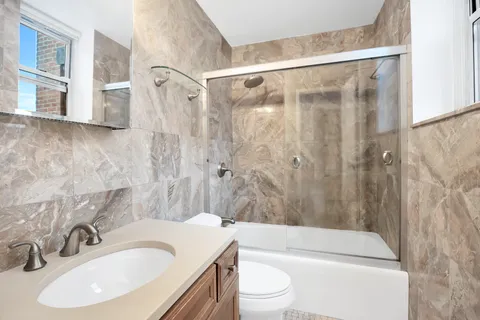 a view of a patio with a table and chairs