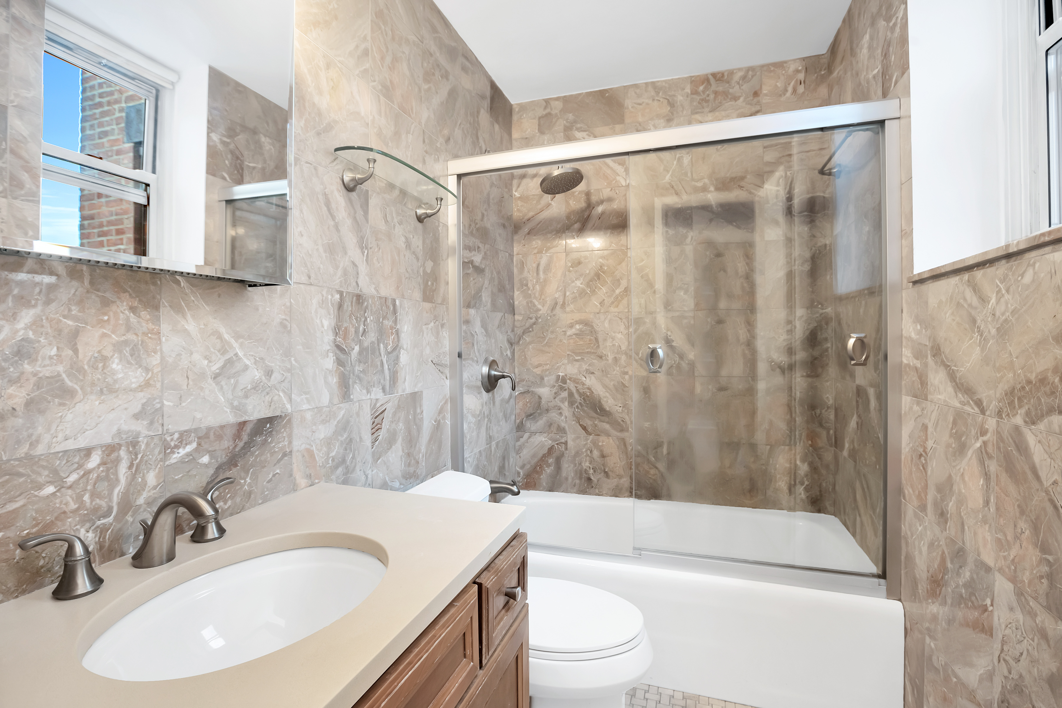 26 Gramercy Park South, Unit 6D Manhattan, NY 10003 - Photo 5 of 9 a bathroom with a sink toilet and shower