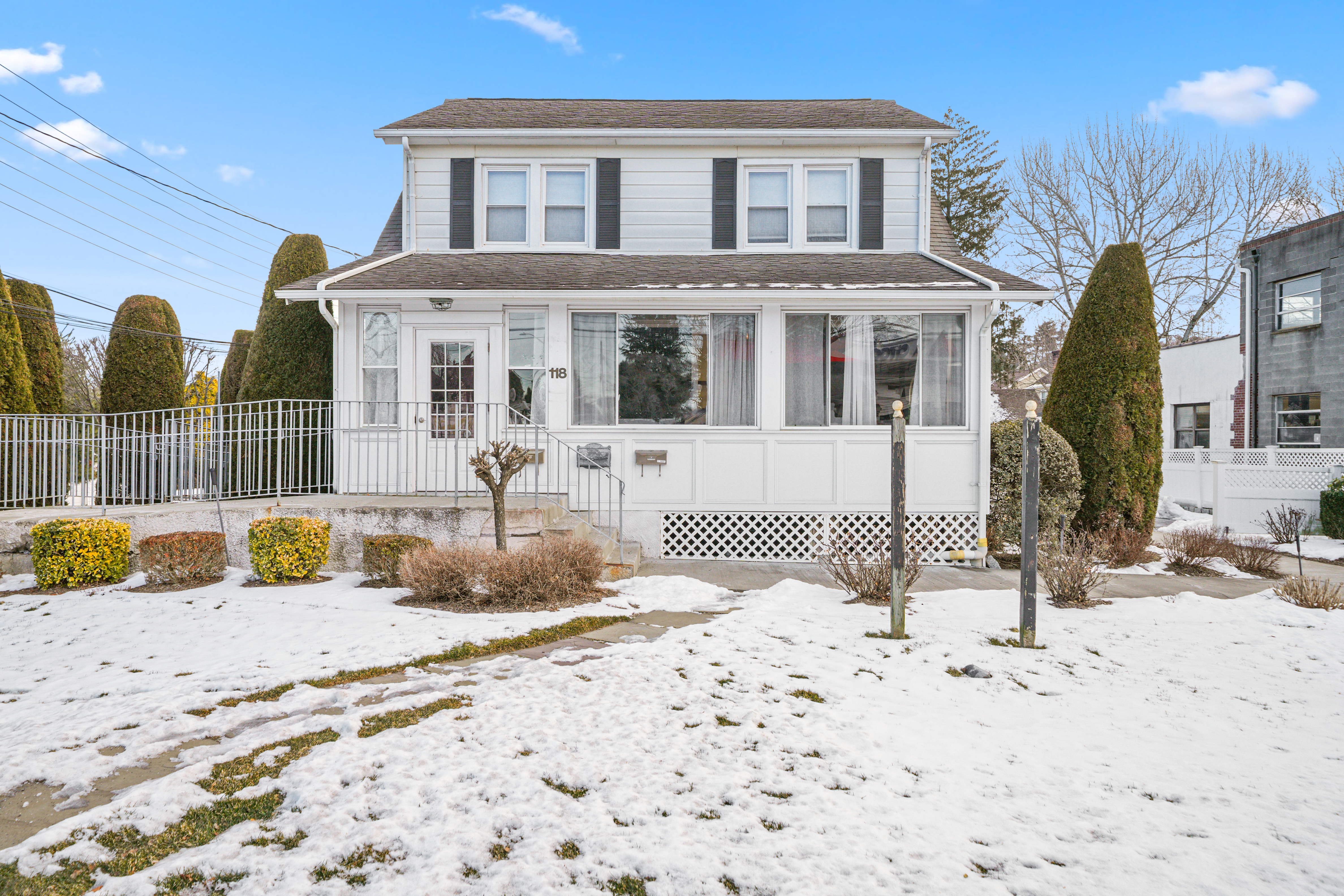 118 Columbus Avenue Valhalla, NY 10595 - Photo 1 of 15 a view of a house with snow on the floor