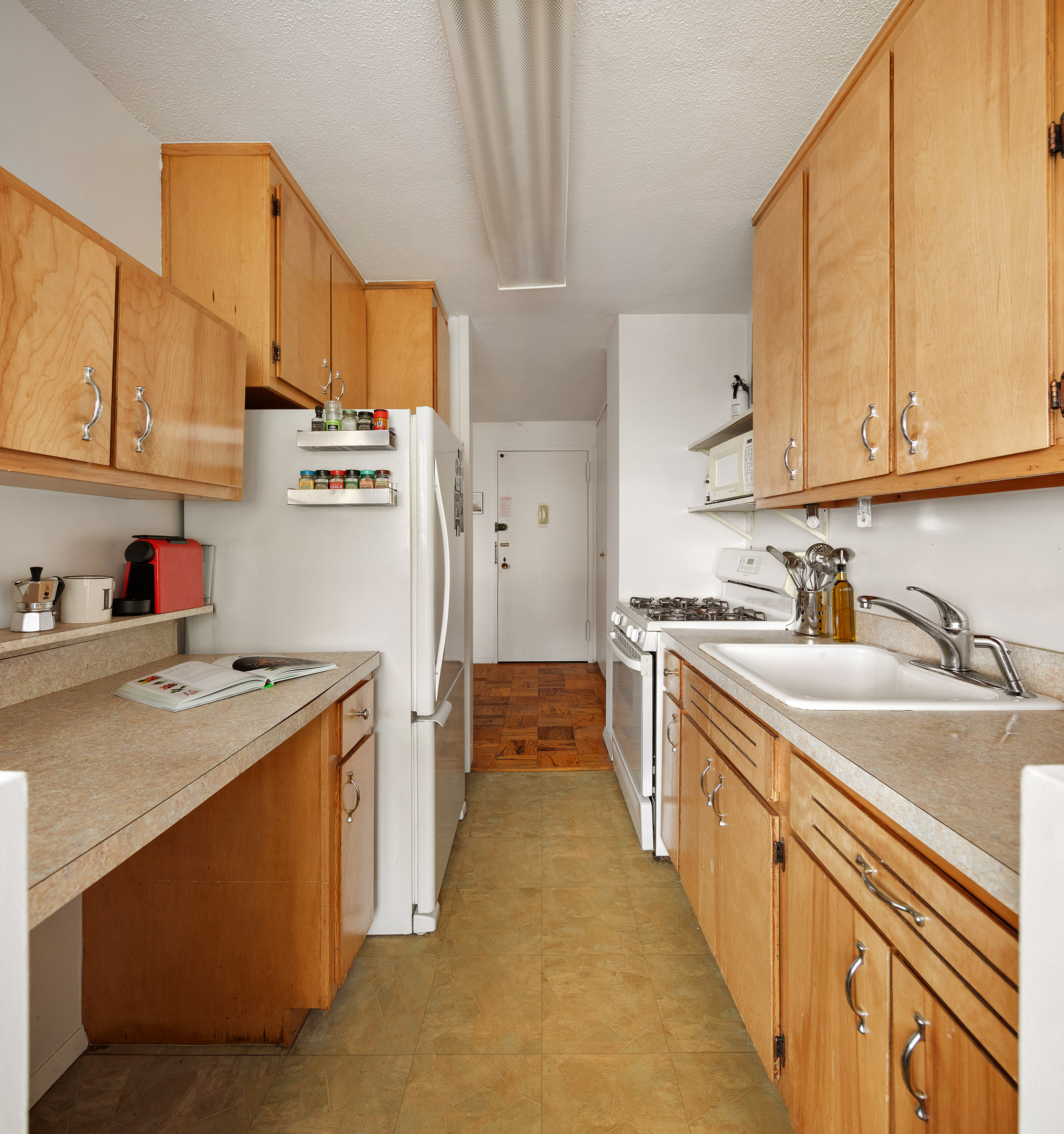 75 Henry Street, Unit 25J Brooklyn, NY 11201 - Photo 9 of 15 a kitchen with a sink stove and cabinets