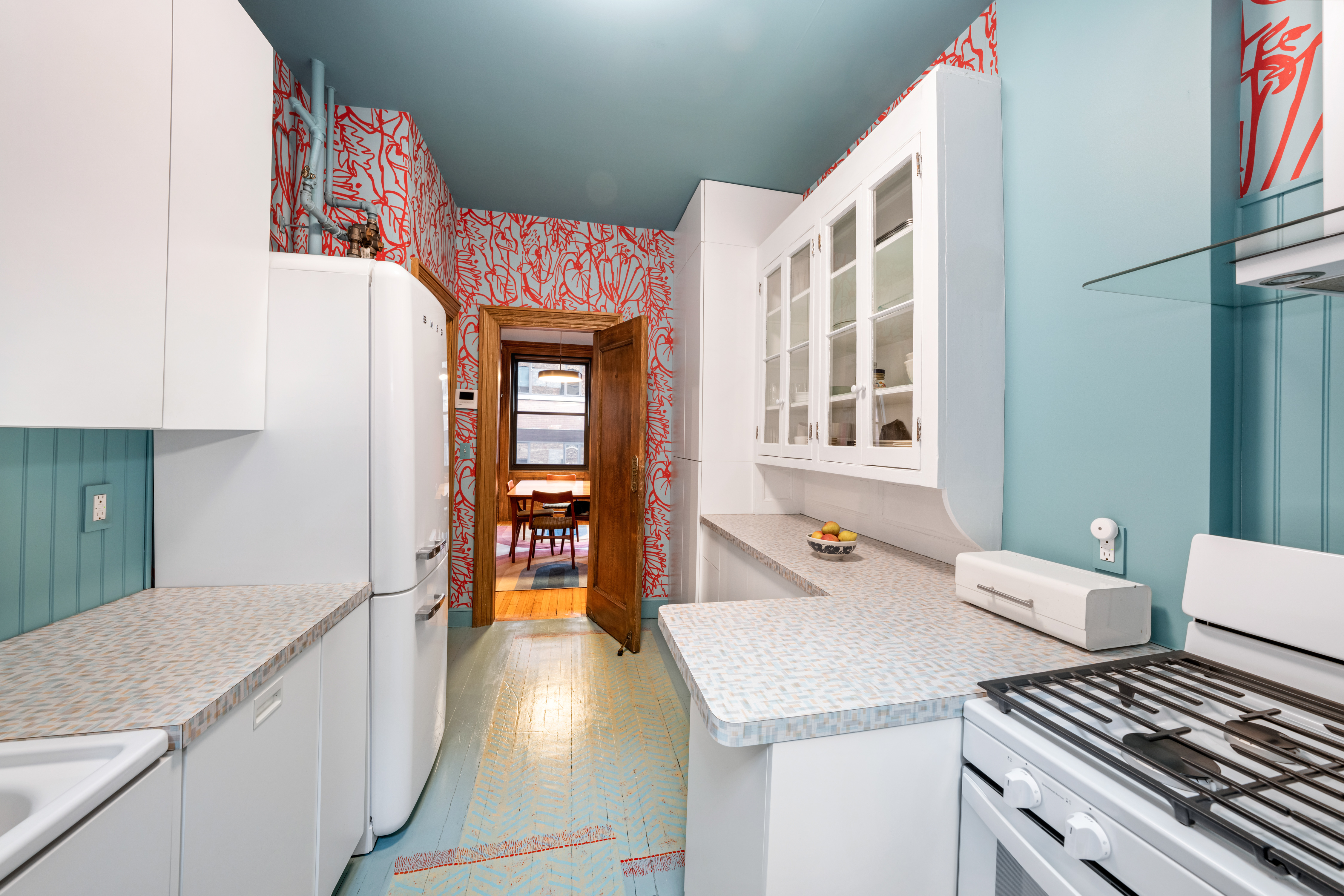 605 West 111th Street, Unit 43 Manhattan, NY 10025 - Photo 13 of 21 a kitchen with a stove and a refrigerator