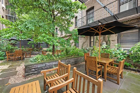 a view of an chair and table in the patio
