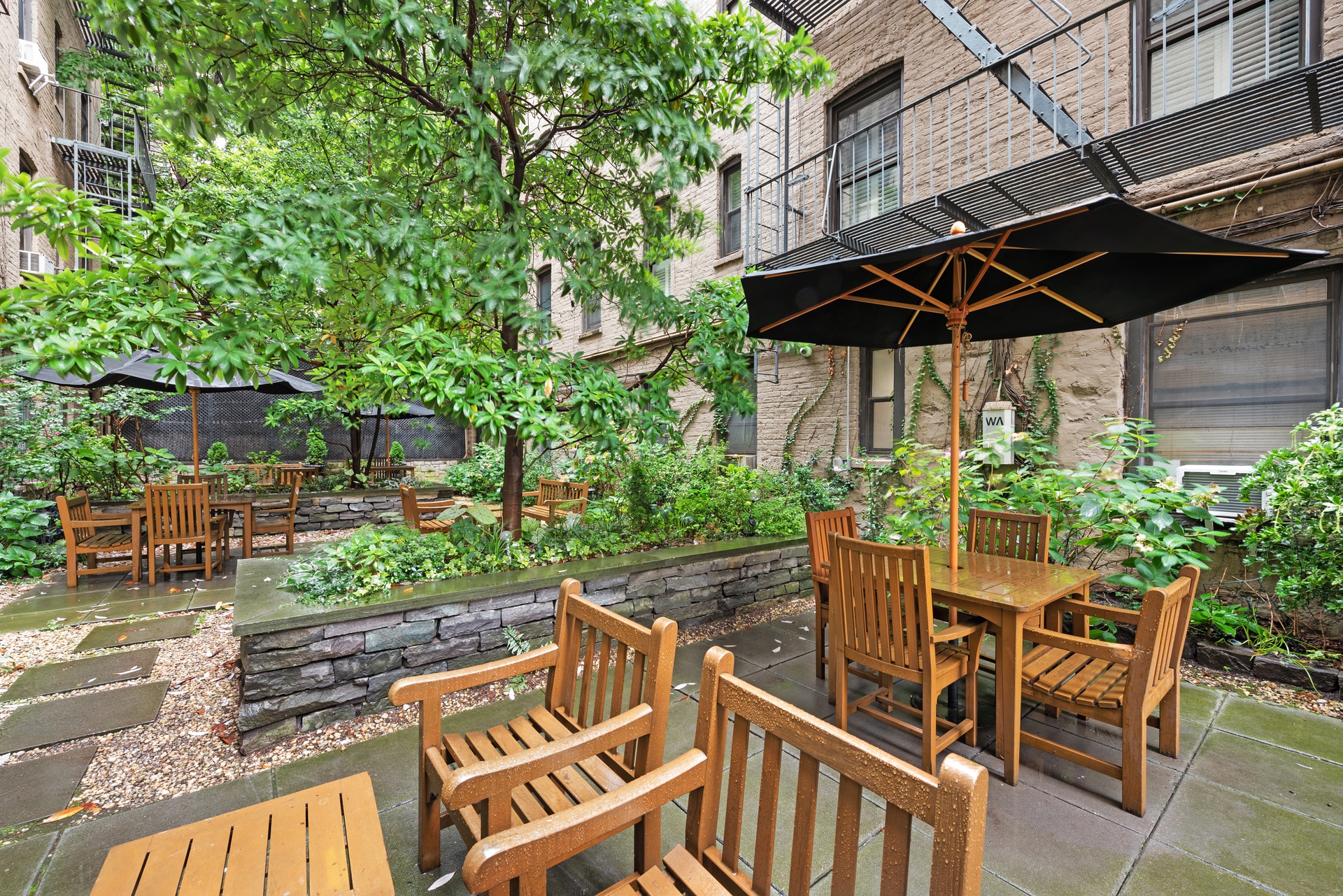 65 Morton Street, Unit 2N Manhattan, NY 10014 - Photo 11 of 12 a view of an chair and table in the patio