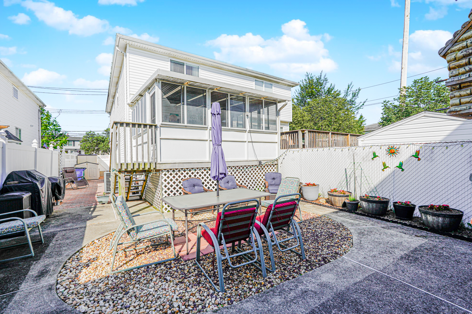 287 Greaves Avenue Staten Island, NY 10308 - Photo 31 of 35 a view of a patio with a table and chairs