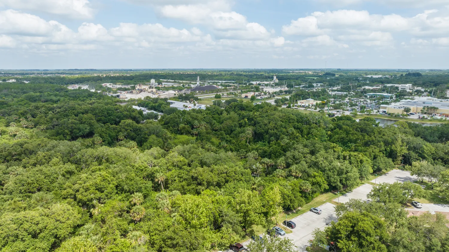 an aerial view of residential houses with city view