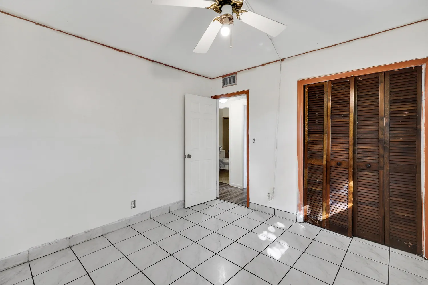 a view of an empty room with a window