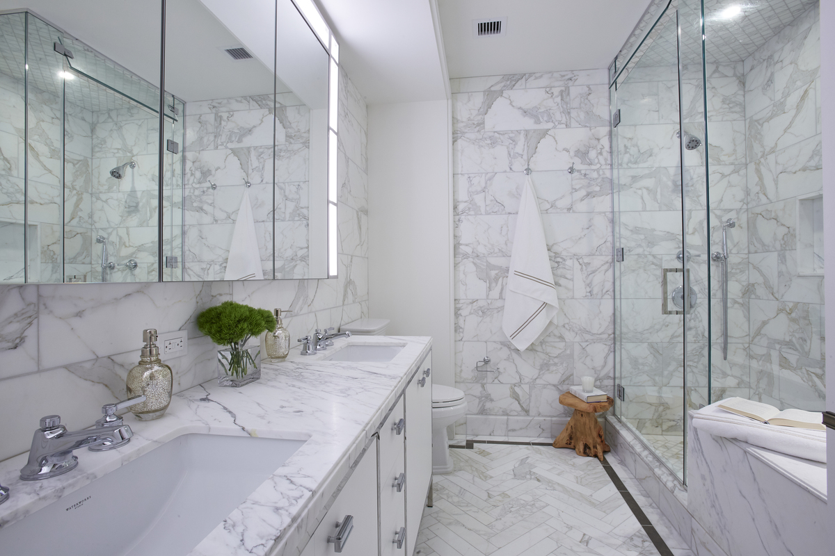 100 Barclay Street, Unit 14M Manhattan, NY 10007 - Photo 10 of 19 a bathroom with a granite countertop sink a toilet and bathtub