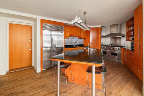 a view of a swimming pool with a lounge chairs