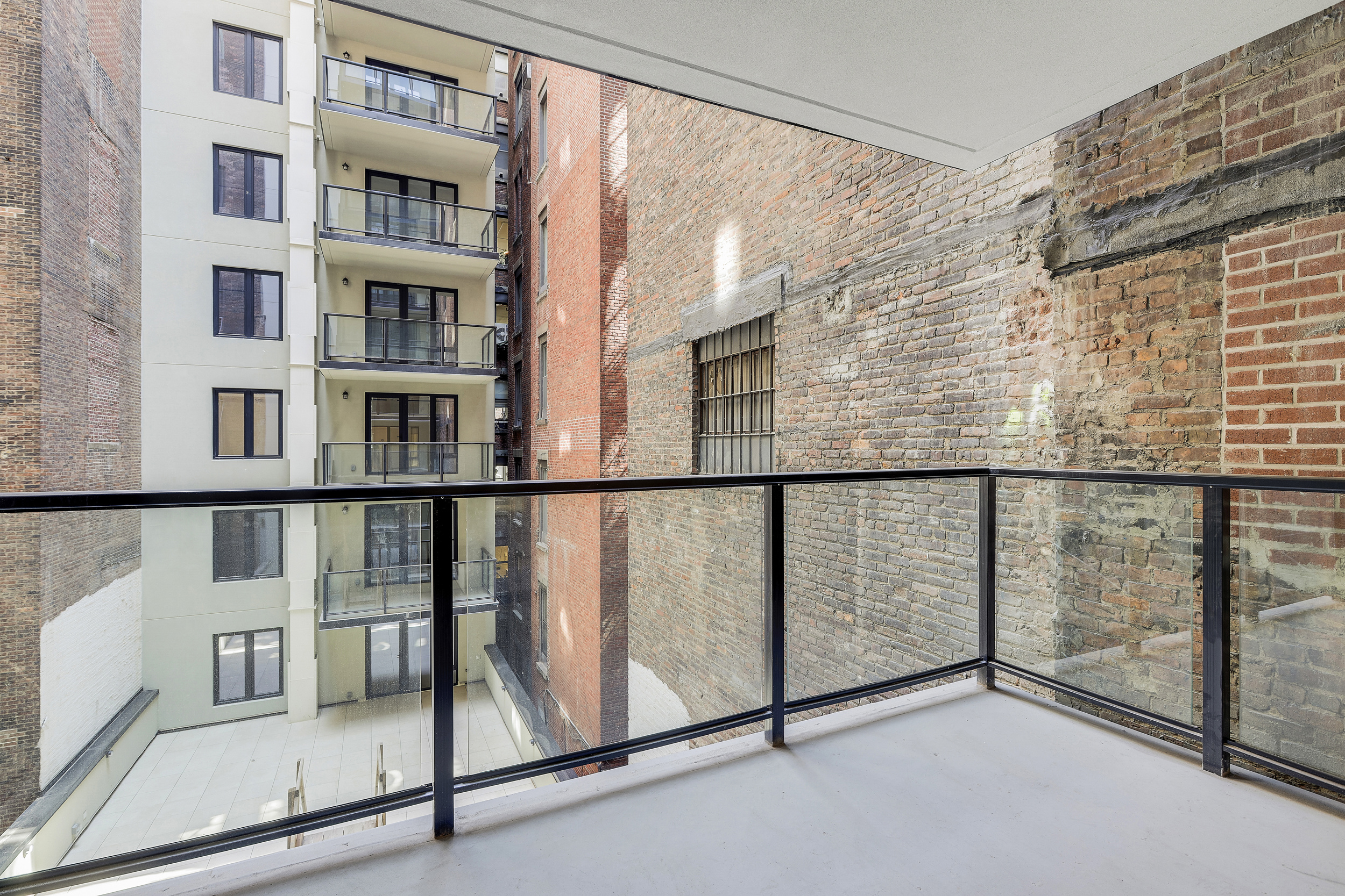 21 West 17th Street, Unit 4 Manhattan, NY 10011 - Photo 11 of 11 a view of staircase with railing and stairs