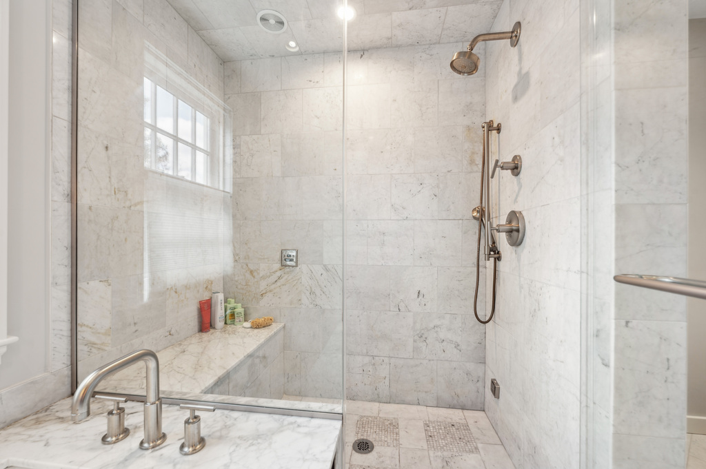 79 Pine Street Dover, MA 02030 - Photo 16 of 25 a bathroom with a granite countertop shower a sink and a mirror