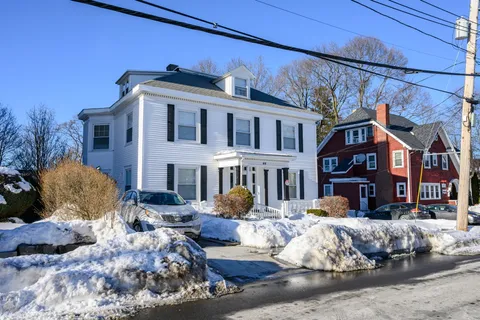 a front view of a house with yard outdoor seating