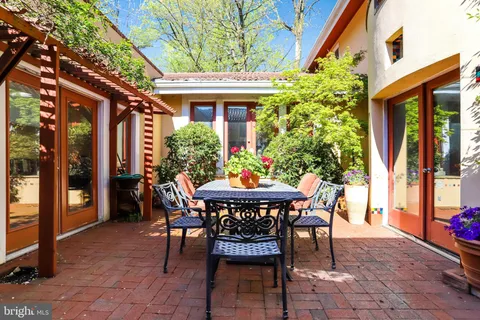 a outdoor dining space with furniture and outdoor view