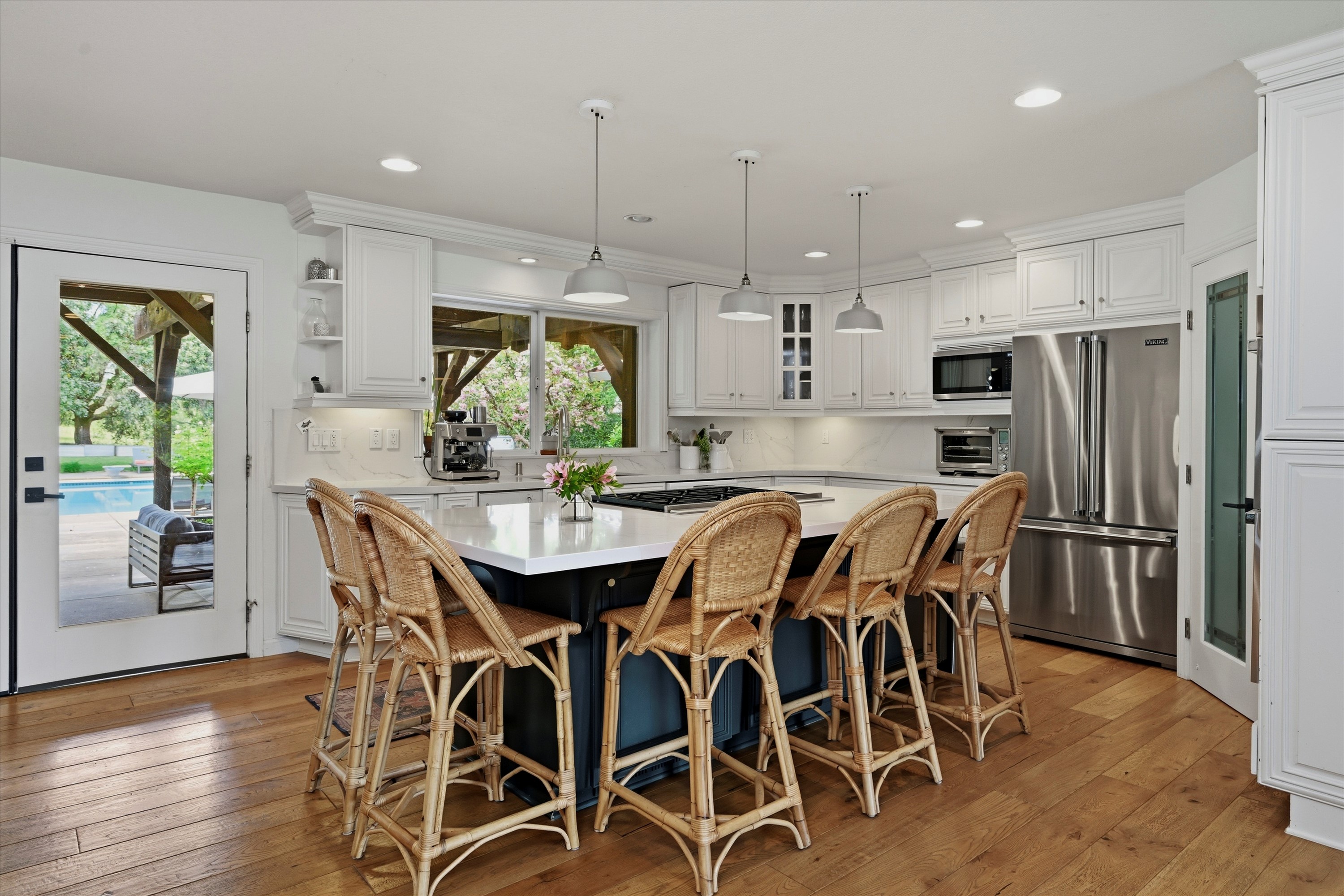 1541 Chablis Road Healdsburg, CA 95448 - Photo 5 of 19 a kitchen with stainless steel appliances a dining table chairs and wooden floor