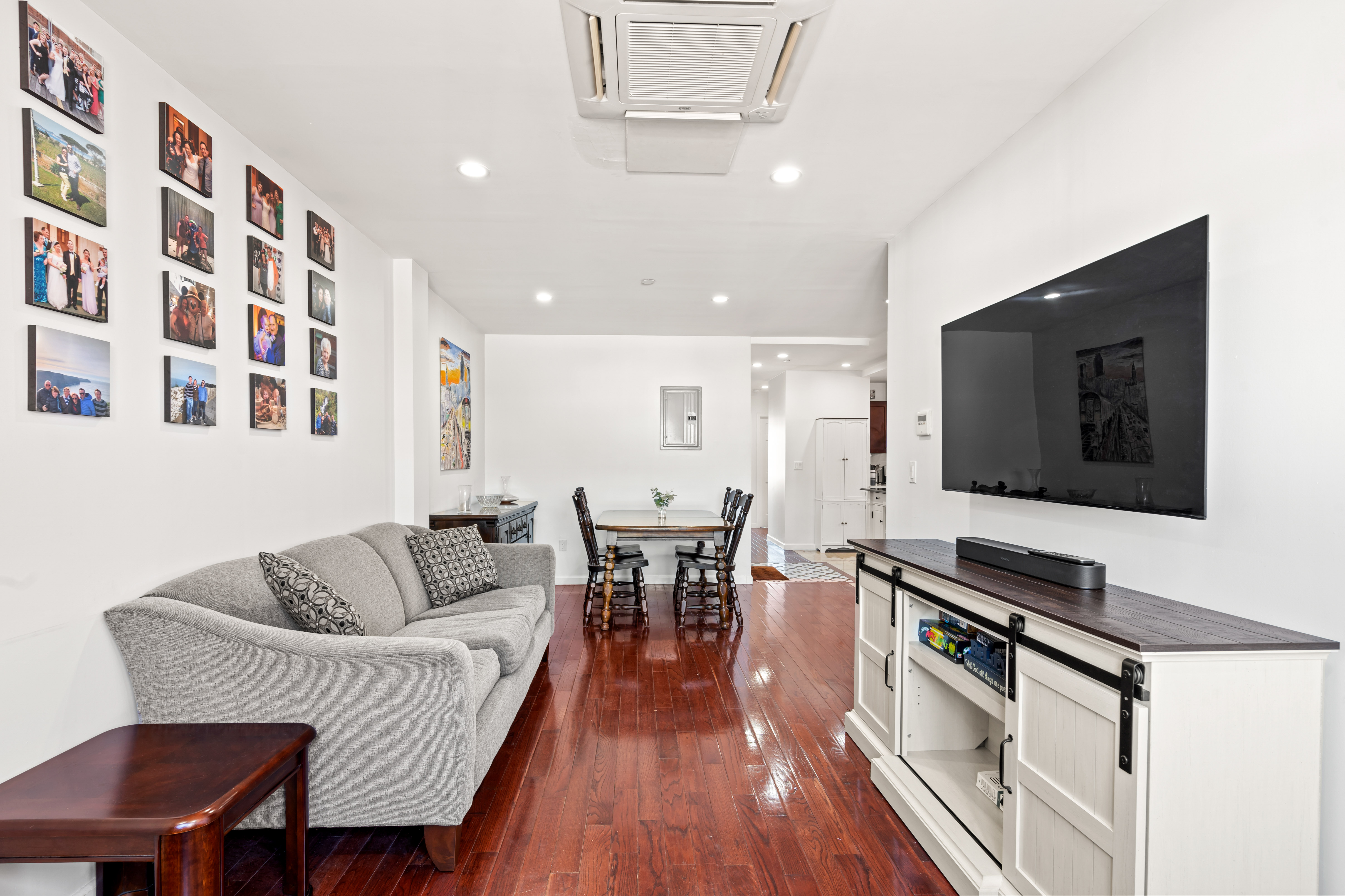 65-33 38th Avenue, Unit 5 Queens, NY 11377 - Photo 2 of 23 a living room with furniture and a flat screen tv