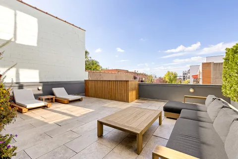 a view of a terrace with furniture