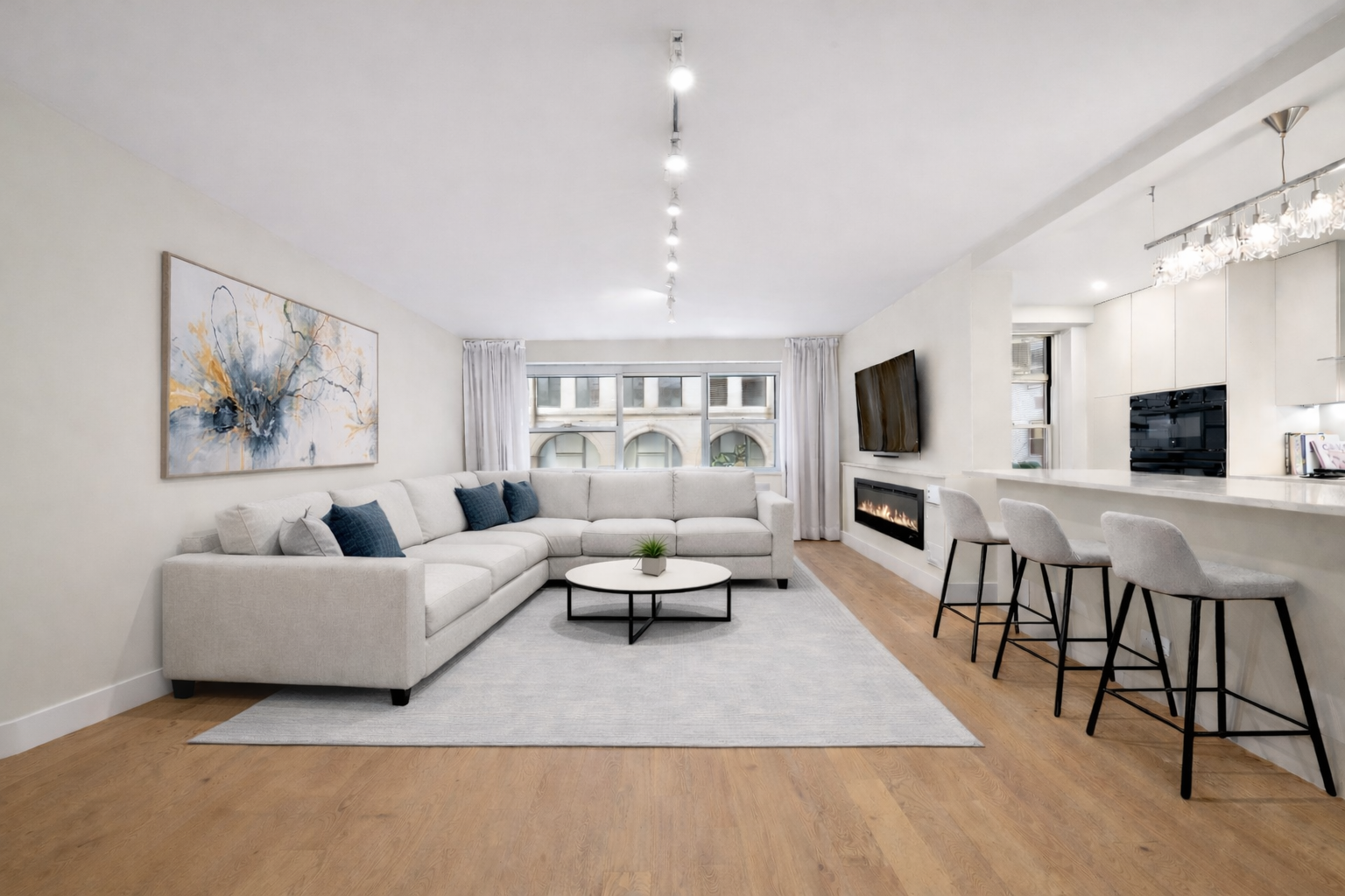 70 East 10th Street, Unit 4V Manhattan, NY 10003 - Photo 1 of 26 a living room with furniture and a flat screen tv