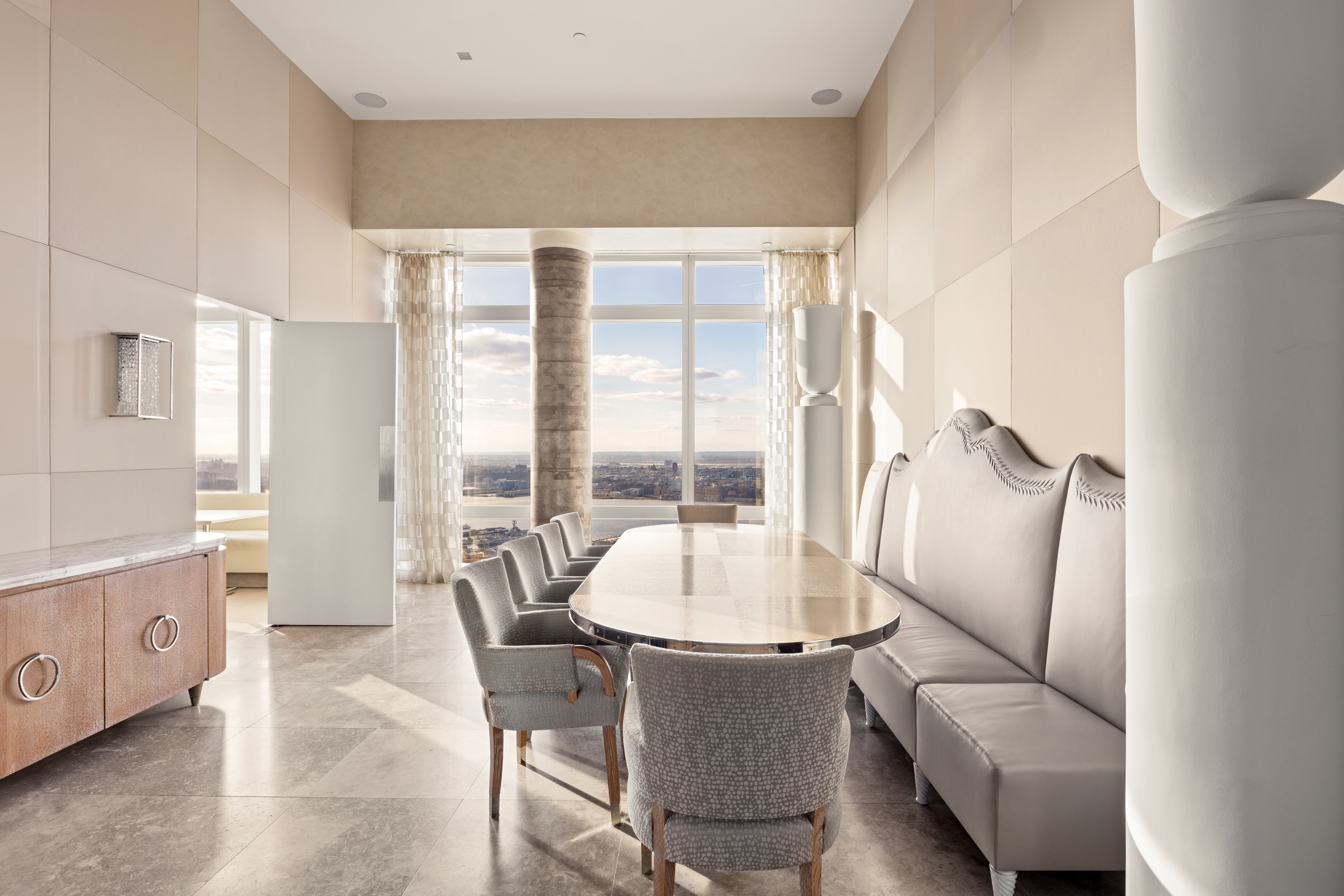 25 Columbus Circle, Unit 75A Manhattan, NY 10019 - Photo 6 of 36 a living room with furniture and a large window