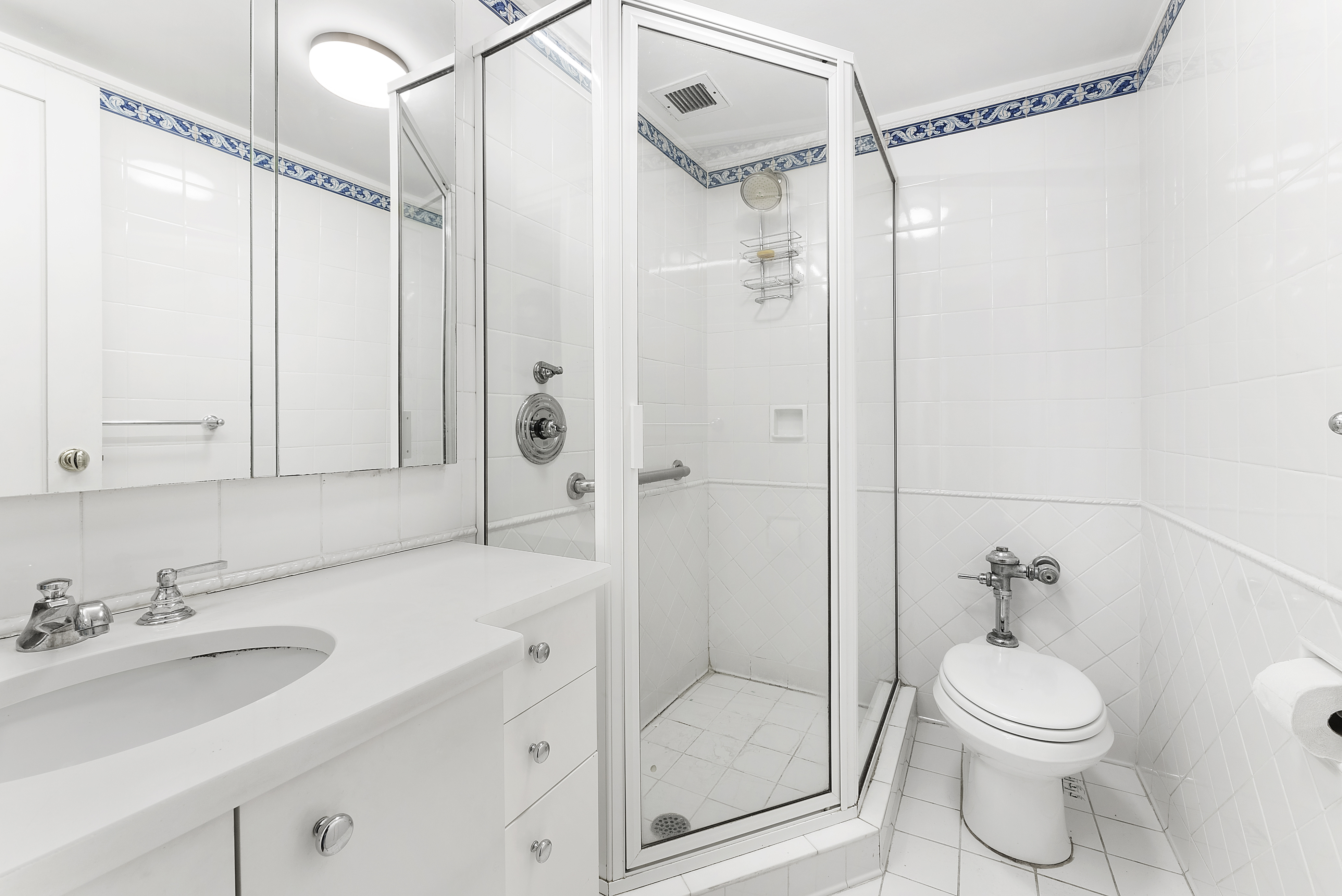 2 5th Avenue, Unit 55 Manhattan, NY 10011 - Photo 13 of 20 a bathroom with a sink a toilet and shower